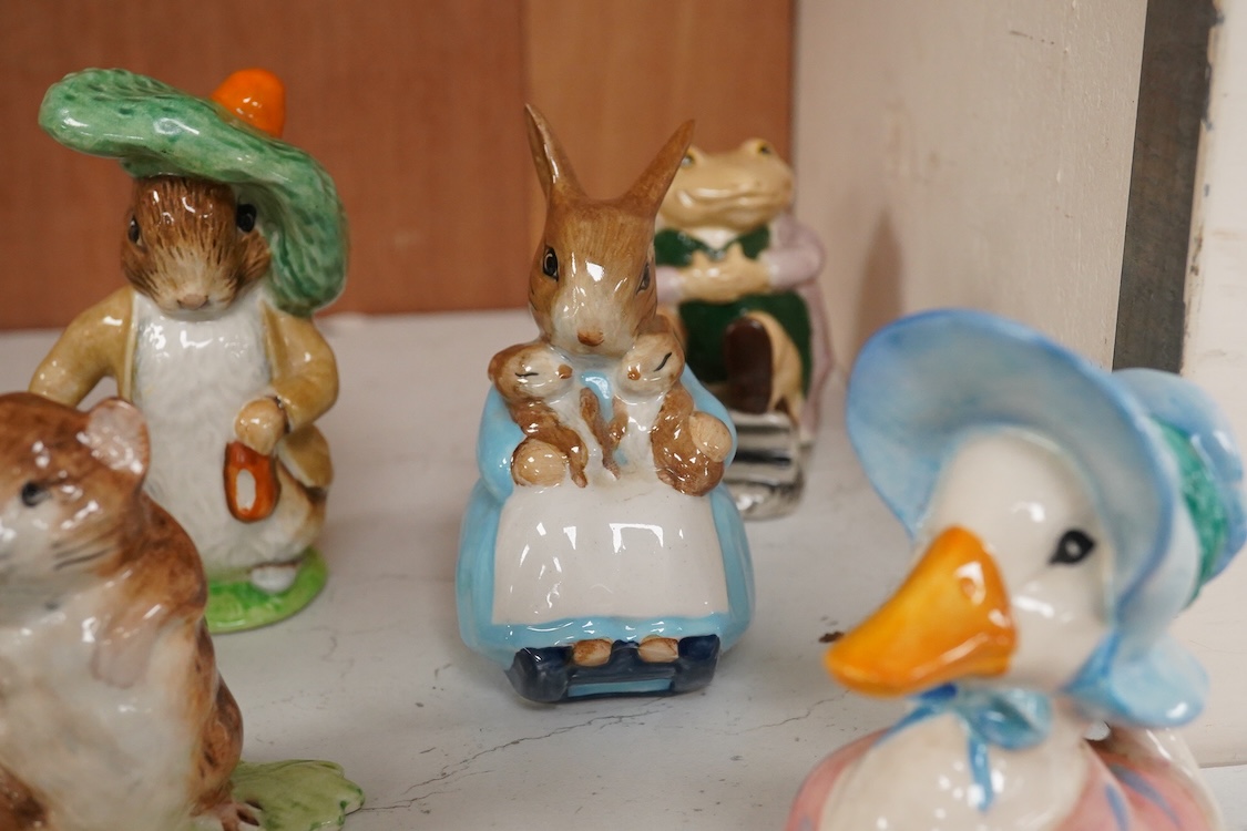 Twenty Beatrix Potter figures, mostly later production figures, largest 11cm high